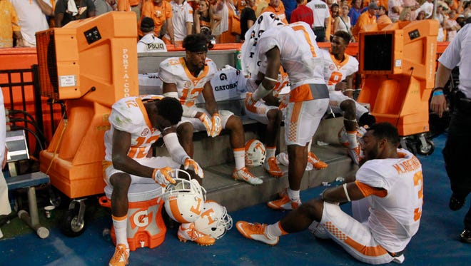 Tennessee defensive back Micah Abernathy (3) and teammates react after they lost to the Florida Gators 28-27 on Sept. 26, 2015.