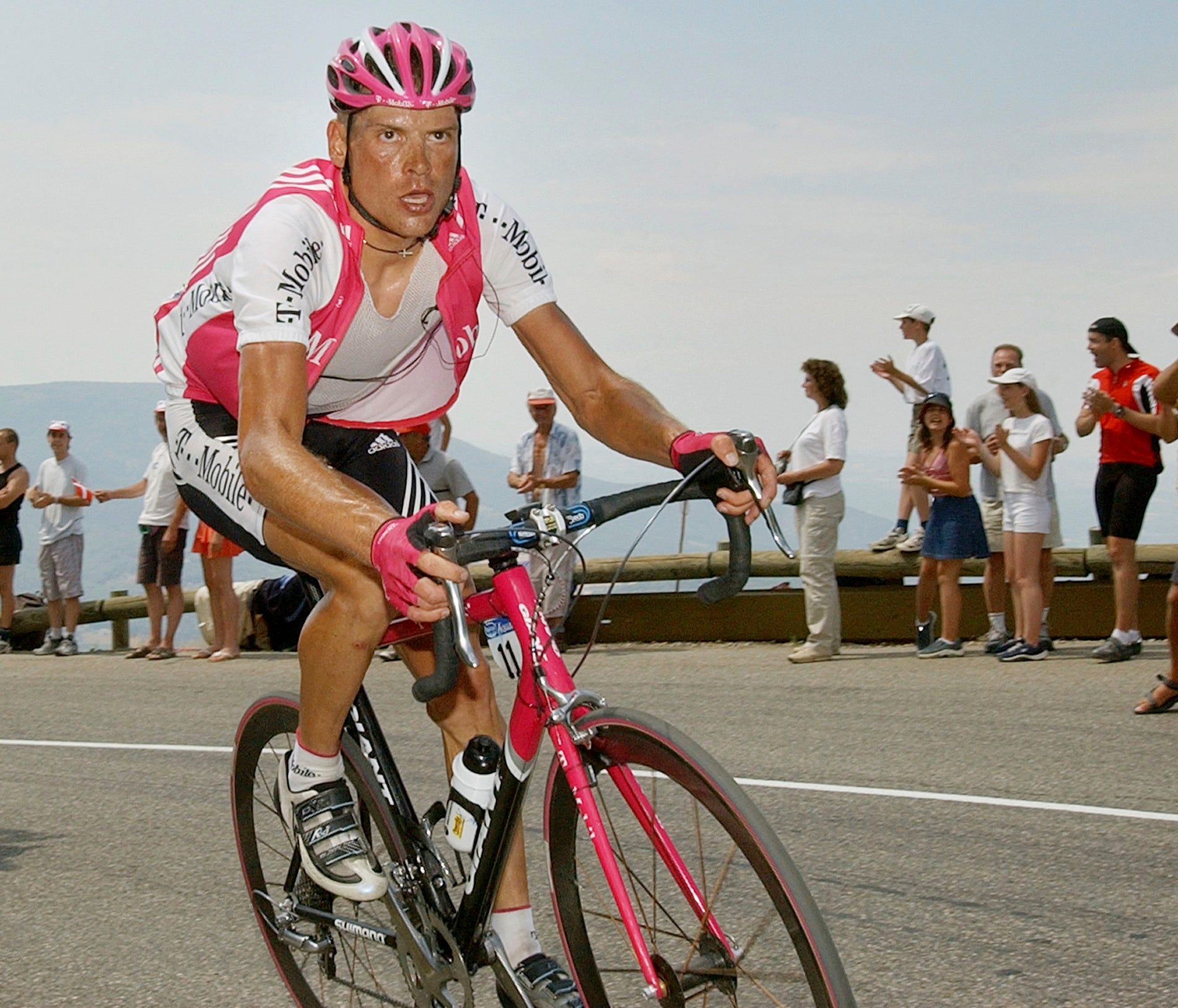 FILE - In this July 20, 2004 file photo T-Mobile team leader Jan Ullrich of Germany pedals during his attack in the ascent of the Echarasson pass during the 15th stage of the Tour de France cycling race between Valreas, southern France, and Villard-d