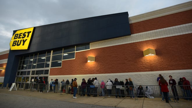 Shoppers lined the front of Best Buy on Thanksgiving to take advantage of holiday deals in this 2014 file photo.