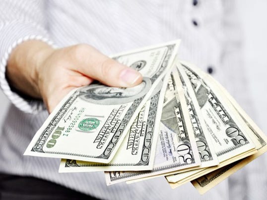 man-holding-bills-fanned-out-in-front-of-him_large.jpg