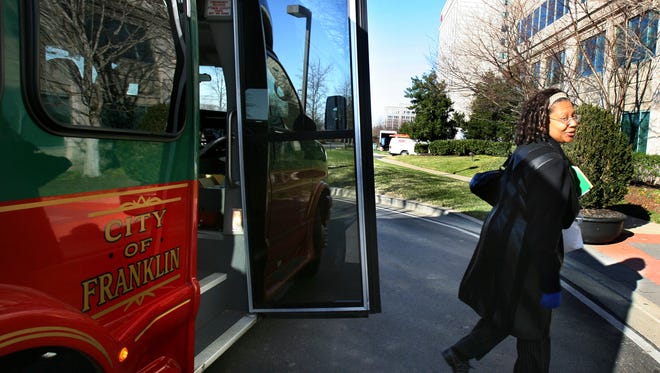 Cecilia Livingston arrives at work in Cool Springs after riding a Franklin Transit Authority transit-on-demand bus in 2008.