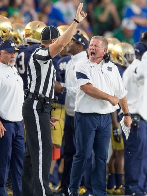 Notre Dame Fighting Irish head coach Brian Kelly argues a penalty call in the first quarter against the Michigan State Spartans at Notre Dame Stadium.