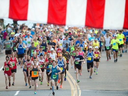 Runners start the Knoxville Marathon on Sunday, April