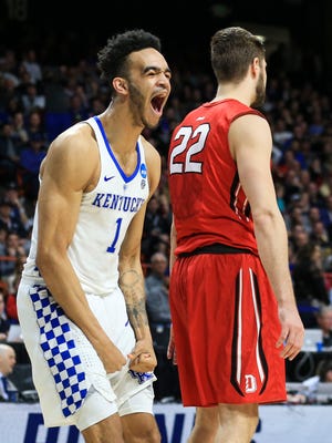 Kentucky's Sacha Killeya-Jones roars after slamming down two and drawing the foul on Davidson's Will Magarity in NCAA first round game in Boise, Idaho Thursday, March 15, 2018. UK won 78-73.
