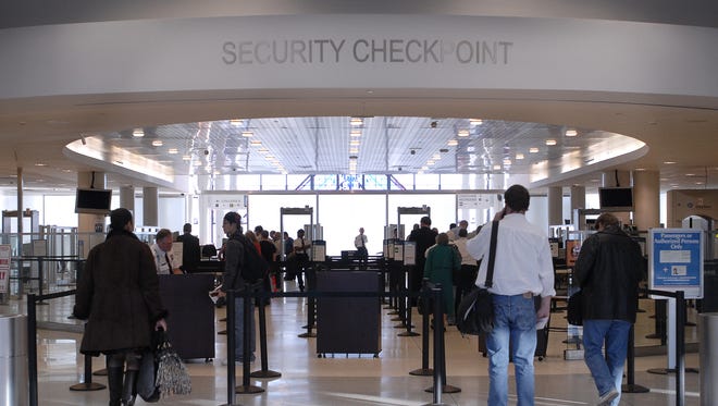 A line forms at the security checkpoint at the Greater Rochester International Airport.