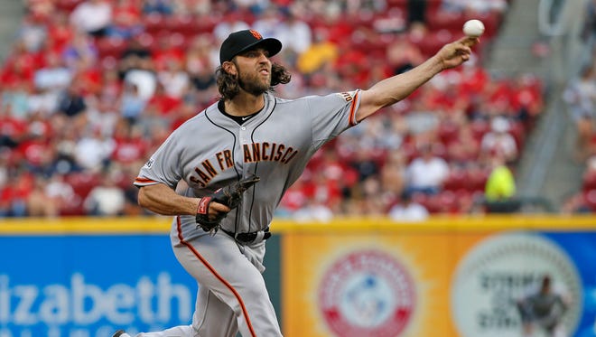 San Francisco Giants starting pitcher Madison Bumgarner (40) delivers a pitch during the bottom of the second inning of the MLB game between the Cincinnati Reds and the San Francisco Giants at Great American Ballpark.