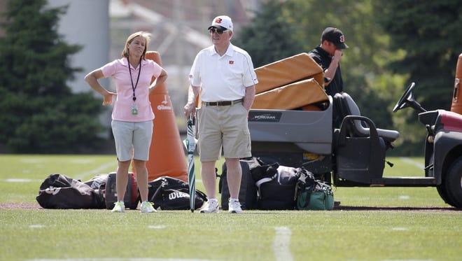 Katie Blackburn, Bengals executive vice president, left, talks with scouting consultant Bill Tobin, during rookie camp in 2015.