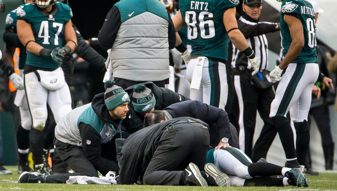 Trainers tend to Eagles returner Darren Sproles, who was hit while waiting to catch a punt in the fourth quarter of the Eagles 27-22 loss to Washington at Lincoln Financial Field.