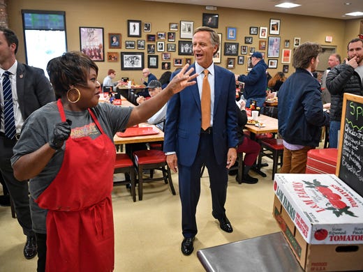 Debra Fuller tells Gov. Bill Haslam about the chocolate