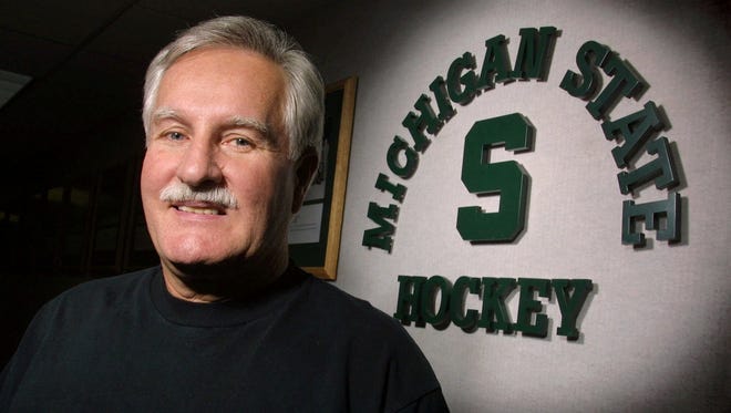 Michigan State hockey coach Ron Mason poses for a photo March 7, 2001, in East Lansing.