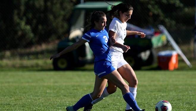 Western Mennonite's Kieley Griffin (3) and Blanchet's Briana Anaya (1) both chase the ball in the Western Mennonite vs. Blanchet girls soccer game at Blanchet Catholic School in Salem on Thursday, Oct. 5, 2017. Western Mennonite won the game 2-0.