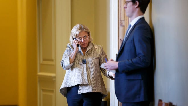Prior to the Senate's vote on the Keystone XL oil pipeline on Nov. 18, 2014, Sen. Mary Landrieu, D-La., the bill's sponsor, steps out of a meeting with members of the Democratic caucus to make a phone call.