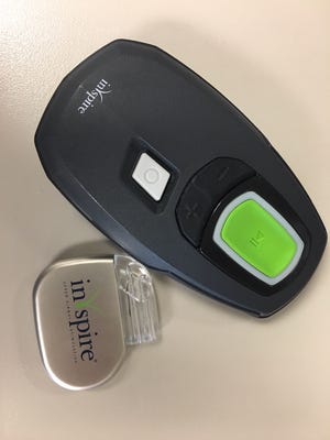 The Inspire device that gets implanted next to the remote control that the patient uses to turn it on.