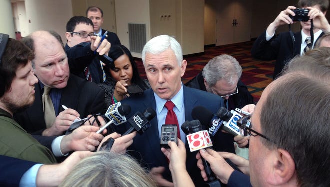 The news media interviews Ind. Gov. Mike Pence