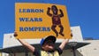 Blaise D'Sylva holds up a sign before Game 2.