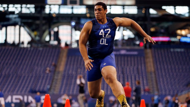 Stanford offensive lineman Andrus Peat runs a drill at the NFL football scouting combine in Indianapolis, Friday, Feb. 20, 2015.