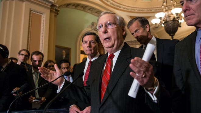 Senate Majority Leader Mitch McConnell of Ky., joined by, from left, Sen. John Barrasso, R-Wyo., Sen. John Thune, R-S.D., and Senate Majority Whip John Cornyn of Texas, faces reporters' questions on controversial statements by Republican presidential candidate Donald Trump, Tuesday, June 7, 2016, during a news conference on Capitol Hill in Washington following a closed-door policy meeting. McConnell called on his party's presumptive nominee to quit scrapping with various minority groups and "get on message" in order to win the White House.