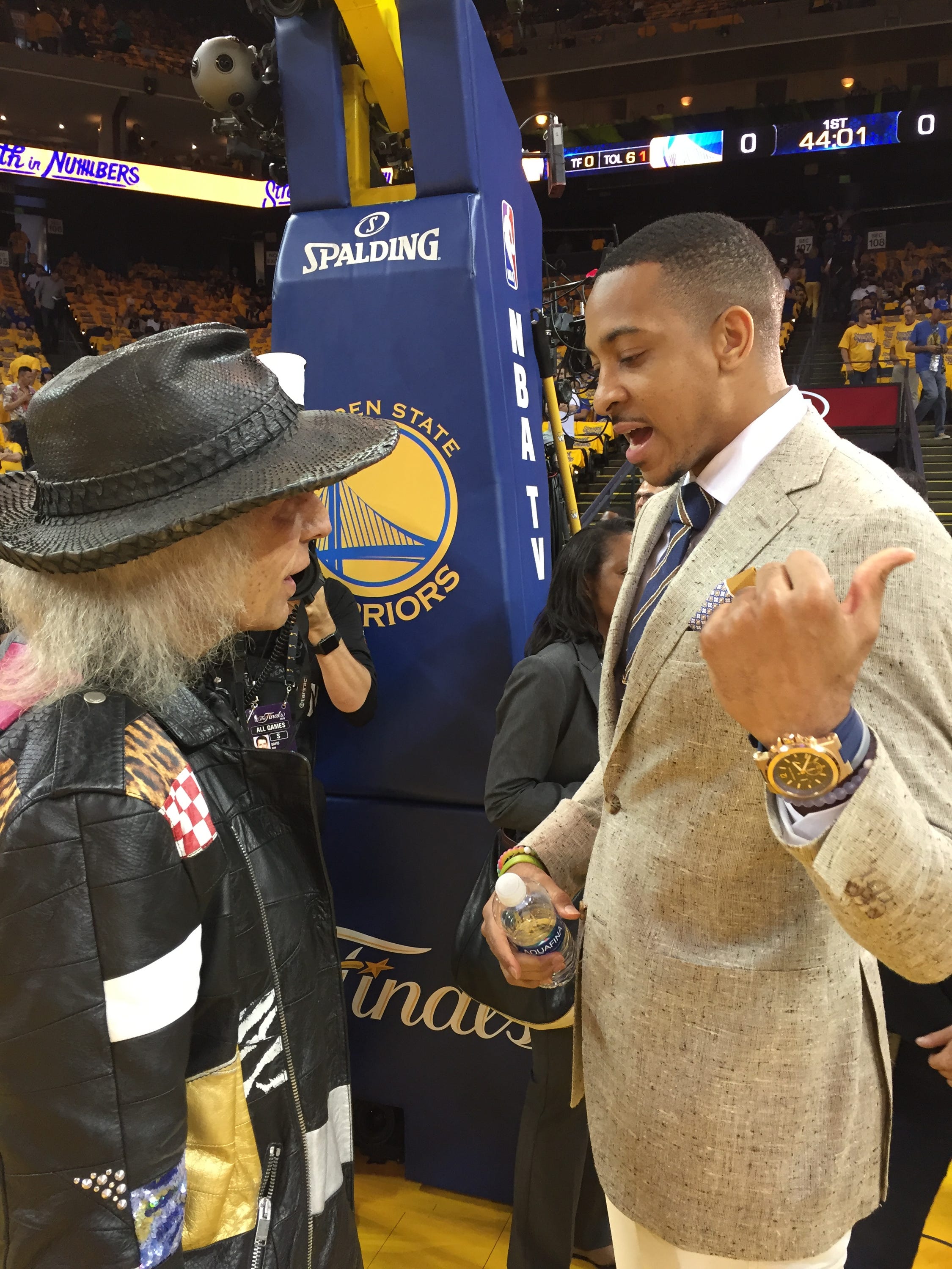 Jimmy Goldstein talks with Portland Trail Blazers guard C.J. McCollum before Game 2 of the NBA Finals on Sunday.