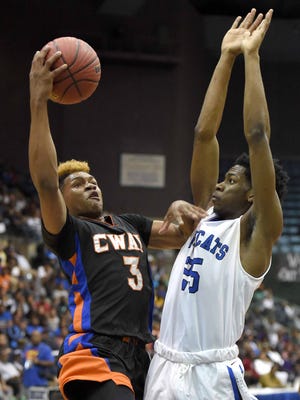 Callaway's John Knight (3) shoots against Meridian's Johnny Magee on Wednesday in a 6A semifinal in Mississippi Coliseum. The game was not completed as of press time. Go to ClarionLedger.com to find the result.