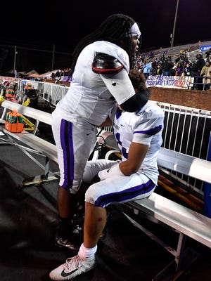 Cane Ridge's Desmond Goodloe (58) consoles Jahsun Bryant (11) after their Class 6A state championship game lost to Maryville at Tucker Stadium in Cookeville, Tenn., Friday, Dec. 1, 2017.