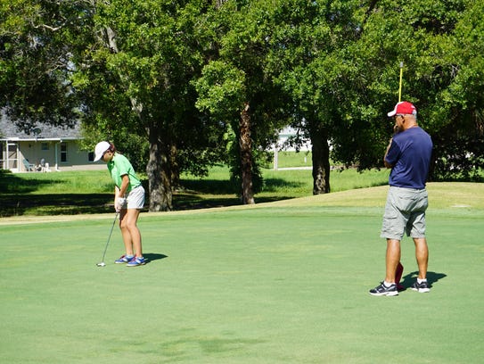 A family bonding over golf for PGA's Family Golf Month.