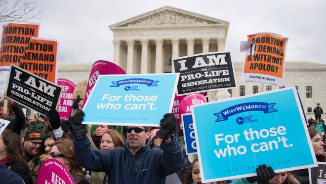 AFP_L54T7.jpg Pro-life activists demonstrate in front of pro-life activists as they intermix during a demonstration in front of the US Supreme Court during the March For Life in Washington, DC, January 27, 2017.
Anti-abortion advocates descended on the US capital on Friday for an annual march expected to draw the largest crowd in years, with the White House spotlighting the cause and throwing its weight behind the campaign.