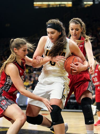 Iowa's Megan Gustafson fights off South Dakota defenders