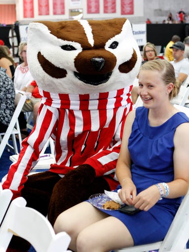 Bucky Badger moves in on a young lady at the Governor's
