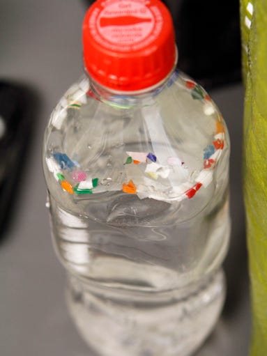 Material from plastic bottles, including caps, are