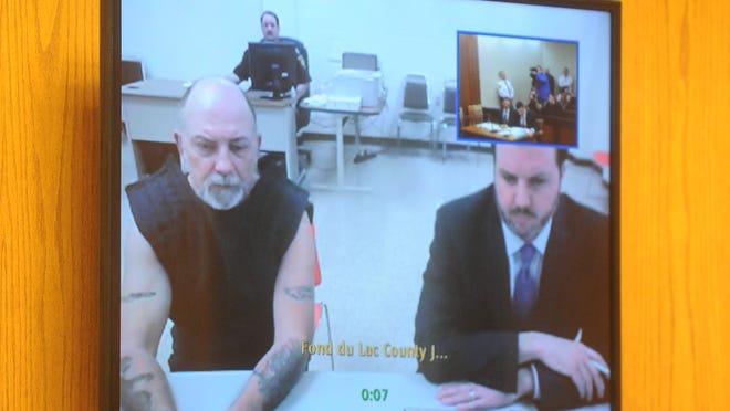 Dennis Brantner, left, appears in court remotely via video teleconference Monday afternoon with defense attorney Craig Powell. Brantner is charged for the 1990 murder of Berit Beck.