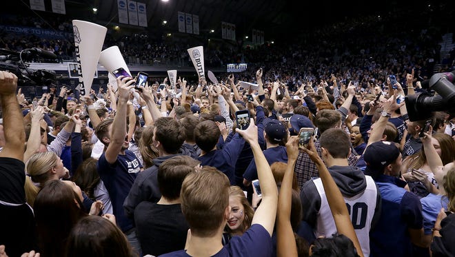 FILE -- The Butler Bulldogs fans storm the court following their game Wednesday, January 4, 2017, evening at Hinkle Fieldhouse. The Butler Bulldogs defeated the Villanova Wildcats 66-58.