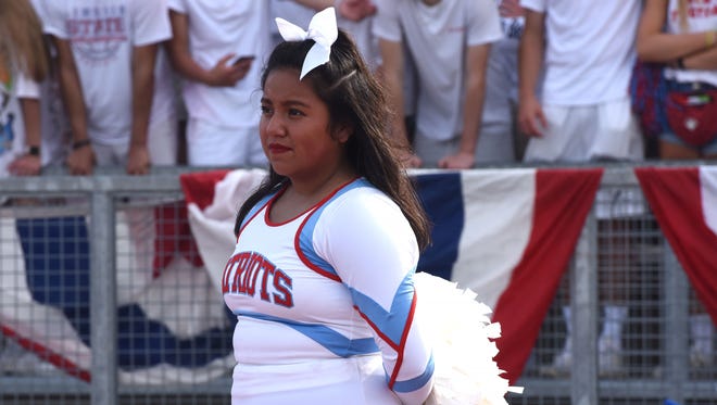 Lincoln High School Sarai Peralta cheers during the Lincoln and Brandon Valley football game on Saturday, Sept. 1, 2018 at Howard Wood Field.