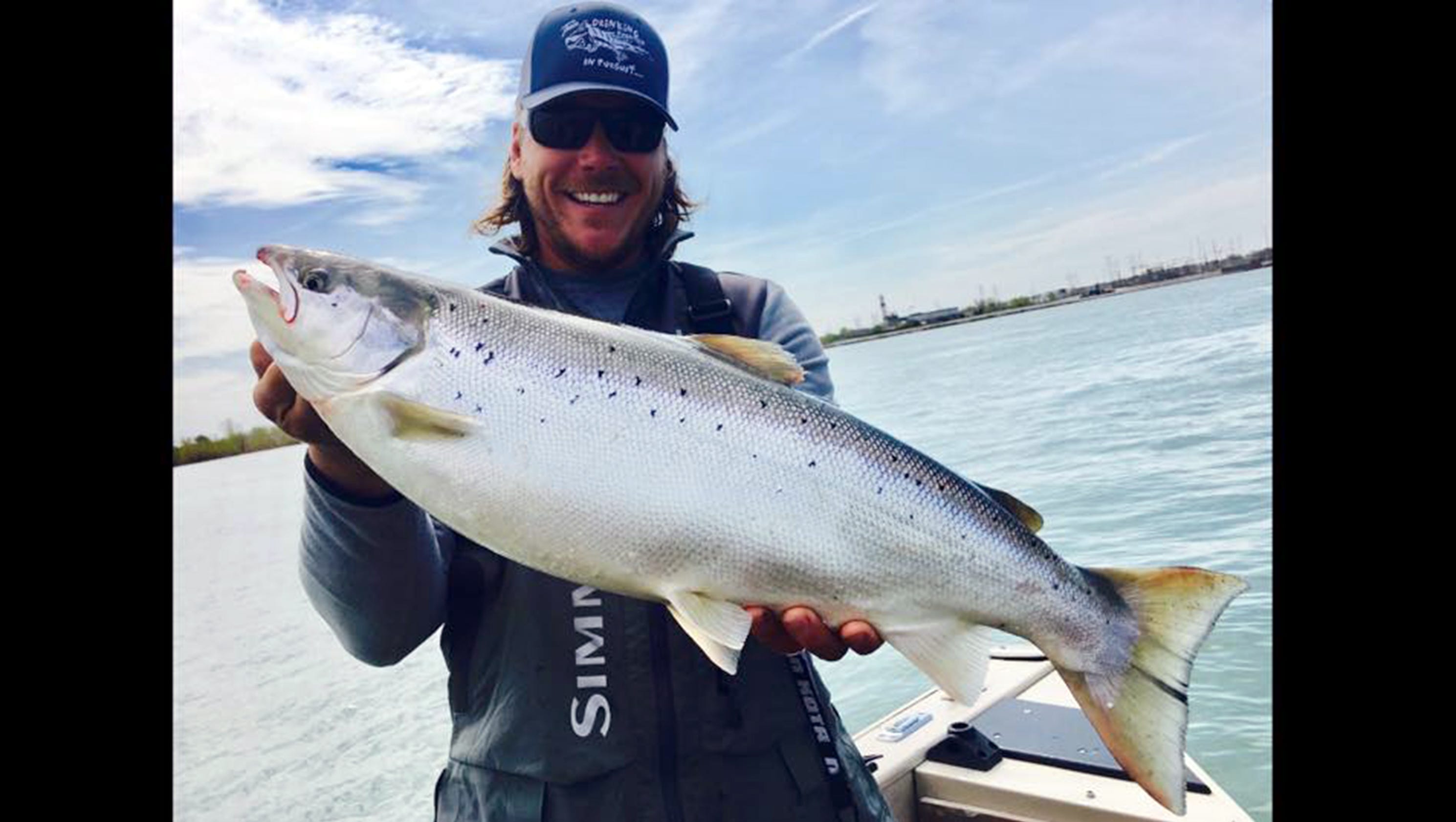 Angler Reels In Atlantic Salmon On The Detroit River