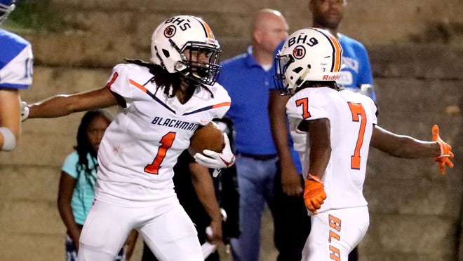 Blackman's Adonis Otey (1) and Michaleous Elder (7) celebrate a touchdown made by Otey against Florence on Friday Aug. 24, 2018 at Braly Municipal Stadium, in Florence, Alabama.