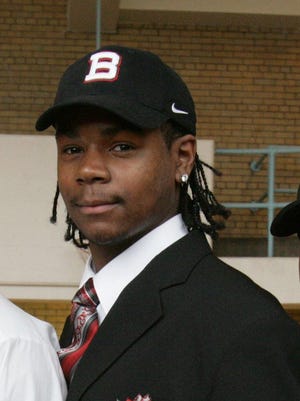 Crockett Technical High School student-athlete Robert Eddins, 17, of Detroit, poses for a photo after signing a letter of intent to Ball State University Wednesday, Feb. 1, 2006, in their school's gym.