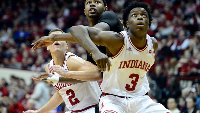 FILE -- Kennesaw State Owls forward Aubrey Williams (14) attempts to get through Indiana Hoosiers forward O.G. Anunoby (3) and guard Nick Zeisloft (2) for a rebound during the second period of the game at Assembly Hall.Indiana defeated Kennesaw State 99 to 72.
