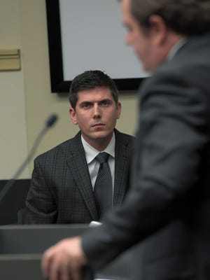 Chris Spognardi, 32, former director of football operations at the University of Tennessee, listens to the charges against him being read in court by Knox County Assistant District Attorney Bill Bright in Criminal Court Thursday, Dec. 14, 2017.  Spognardi entered a guilty plea to a Class E Felony and agreed to repay $14,085.30.