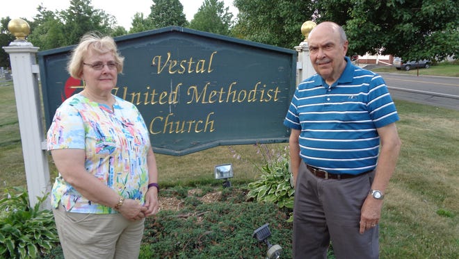 Sandy Kosty and Jim Meade  in front of Vestal United Methodist Church. Both are members of the Stephen Ministry, which helps people facing life crises.