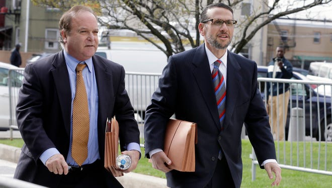 David Wildstein, right, arrives with his attorney Alan Zegas at federal court for a hearing Friday, May 1, 2015, in Newark, N.J.  Wildstein, a former Port Authority appointee of New Jersey Gov. Chris Christie, is set to plead guilty on charges arising from a federal probe into traffic jams he ordered on the George Washington Bridge, allegedly on behalf of Christie. (AP Photo/Mel Evans)  