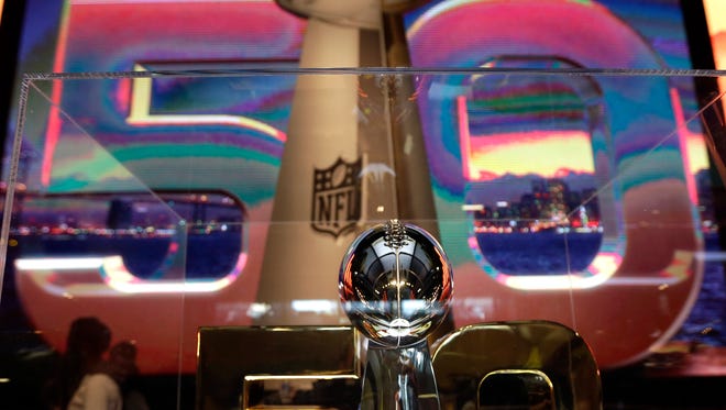 The Vince Lombardi Trophy is displayed inside the NFL Experience on Tuesday in San Francisco. The Denver Broncos will play the Carolina Panthers in Super Bowl 50 on Sunday at Levi's Stadium in Santa Clara, Calif.