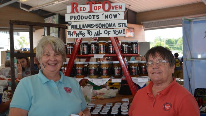 Jane Ford and Kathy Hubbard pose near their booth at Farmers Market of the Ozarks. The ladies own Red Top Oven and six of their products are now available at Williams-Sonoma Frontenac Plaza in Saint Louis.