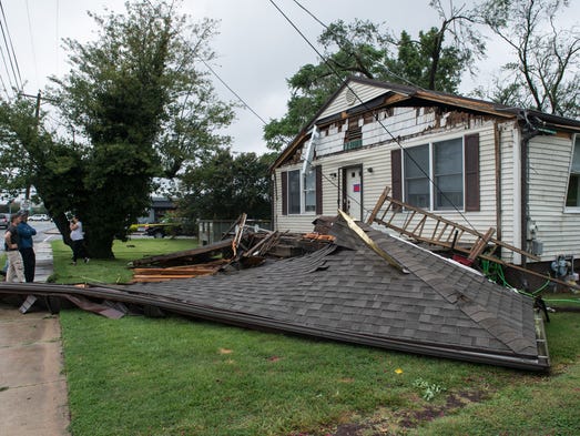 A view of a damaged home on College Avenue after a