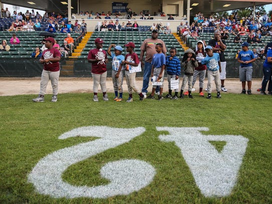 Little Leaguers participate in some of the festivities