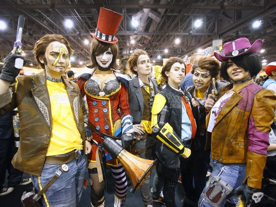 Cosplayers gather in the exhibitor hall during Phoenix