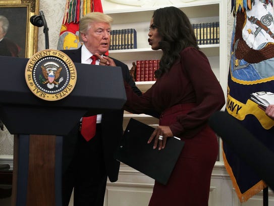 President Trump listens to Omarosa Manigault Newman