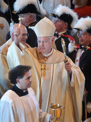 Cardinal Edward Egan, center, consecrates the new Blessed Kateri Tekakwitha Church, Dutchess County's newest and largest Catholic church, during service Sunday, November, 23, 2008, in LaGrangeville.