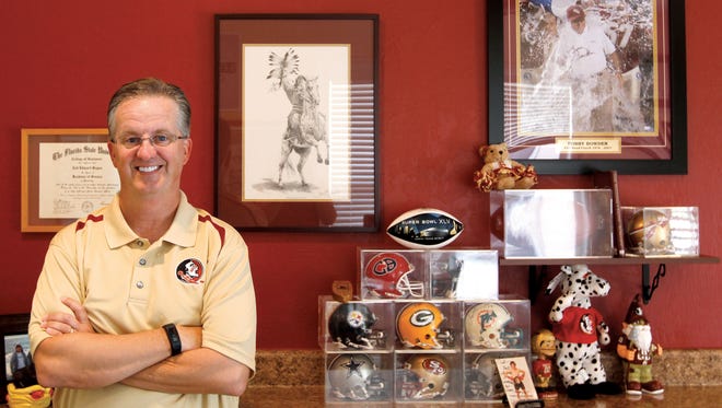 Florida State University grad Tod Bayne, who has a room dedicated to FSU memorabilia, is particularly proud of his Bobby Bowden-signed helmet and football.