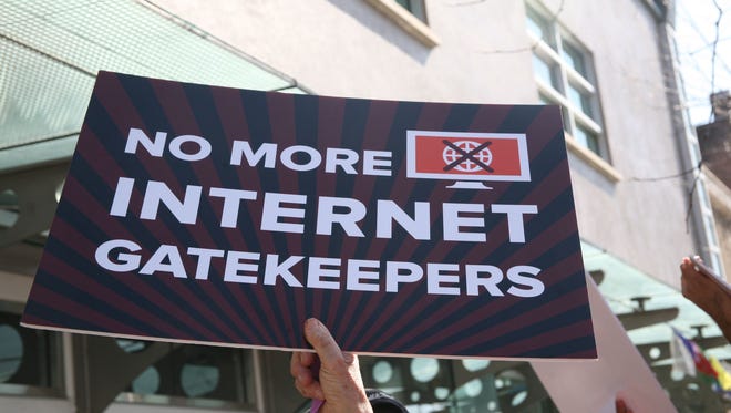 Protesters at a Verizon store in Berkeley, Calif., on Saturday demand that Internet service providers, such as Verizon, AT&T and Comcast, not interfere with the FCC’s plan to change net neutrality rules.