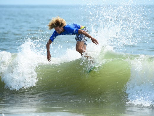 Blair Conklin, Laguna Beach, Ca, catches a wave during
