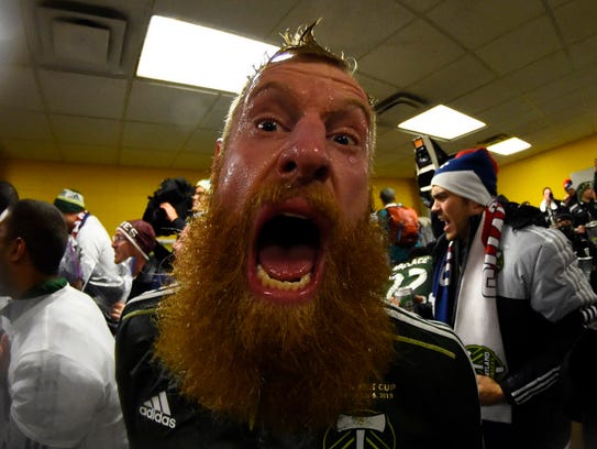 Nat Borchers celebrates in the locker room after the